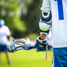 Club select lacrosse player holding a lacrosse stick