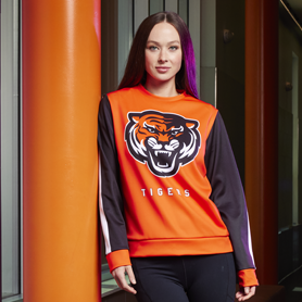 A high school girl athlete wearing custom team apparel