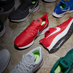 Various colors of Nike footwear for high school sports teams