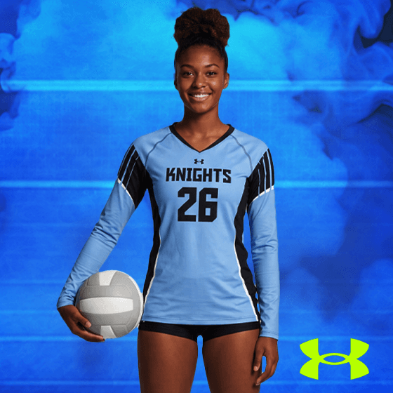 a woman volleyball player wearing a custom blue Under Armour volleyball jersey from BSN SPORTS and holding a volleyball